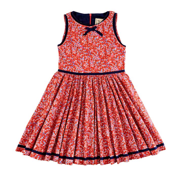 Une magnifique robe qui tourne en coton fleuri rouge, blanc et bleu pour fille et fillette de 2 à 16 ans de la marque de mode française vêtement pour enfant LA FAUTE A VOLTAIRE.