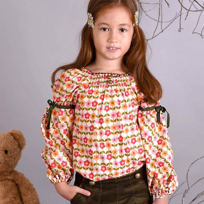 Blouse automne hiver pour fille de 2 à 16 ans en coton fleurie liberty rouge et jaune à manche ballon et col smocks de la marque de mode pour enfants en commerce équitable LA FAUTE A VOLTAIRE