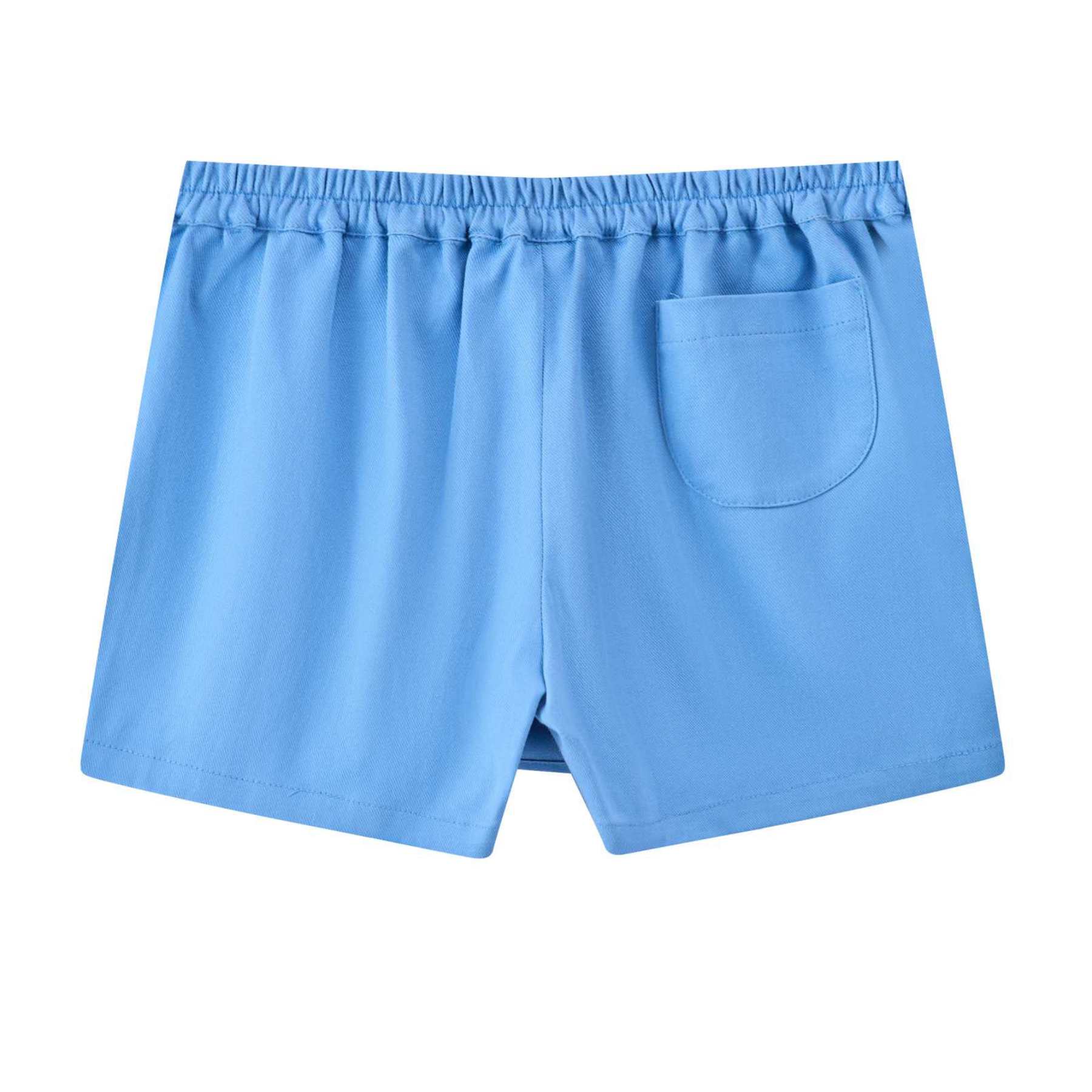 Photo packshot du dos de la jupe short bleu ciel fille avec coupe portefeuille sur le devant. Taille élastique dans le dos. Ceinture fantaisie à fines rayures multicolores. Modèle disponible du 2 au 16 ans. Taille plutôt petit. Optez pour la taille supérerieure si l'enfant est entre deux tailles ou de morphologie un peu ronde.